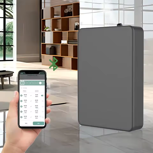 Black scent diffuser in a bright open-plan living space, controlled from a phone over Bluetooth