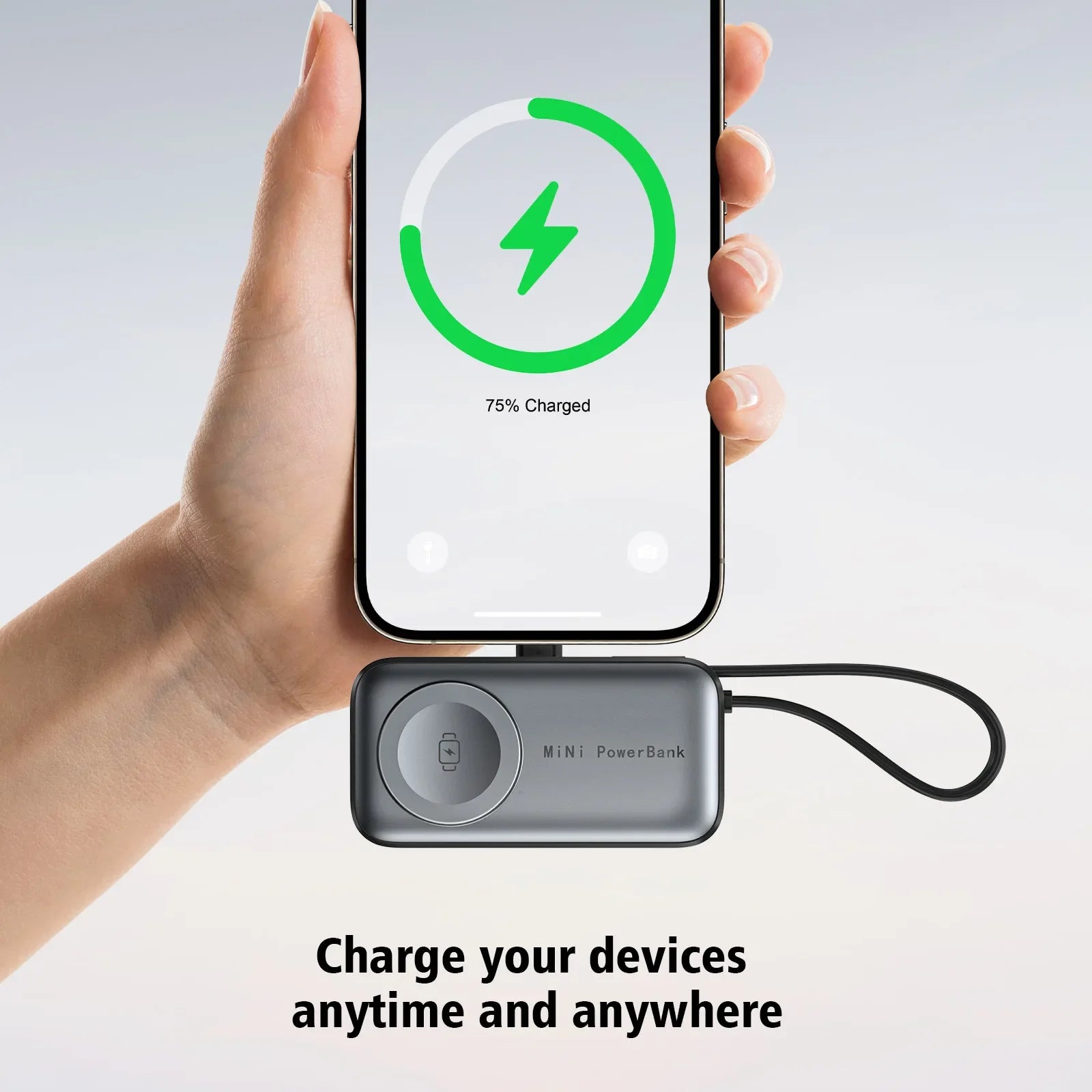 The power bank held below an iPhone showing a 75 percent charge while charging