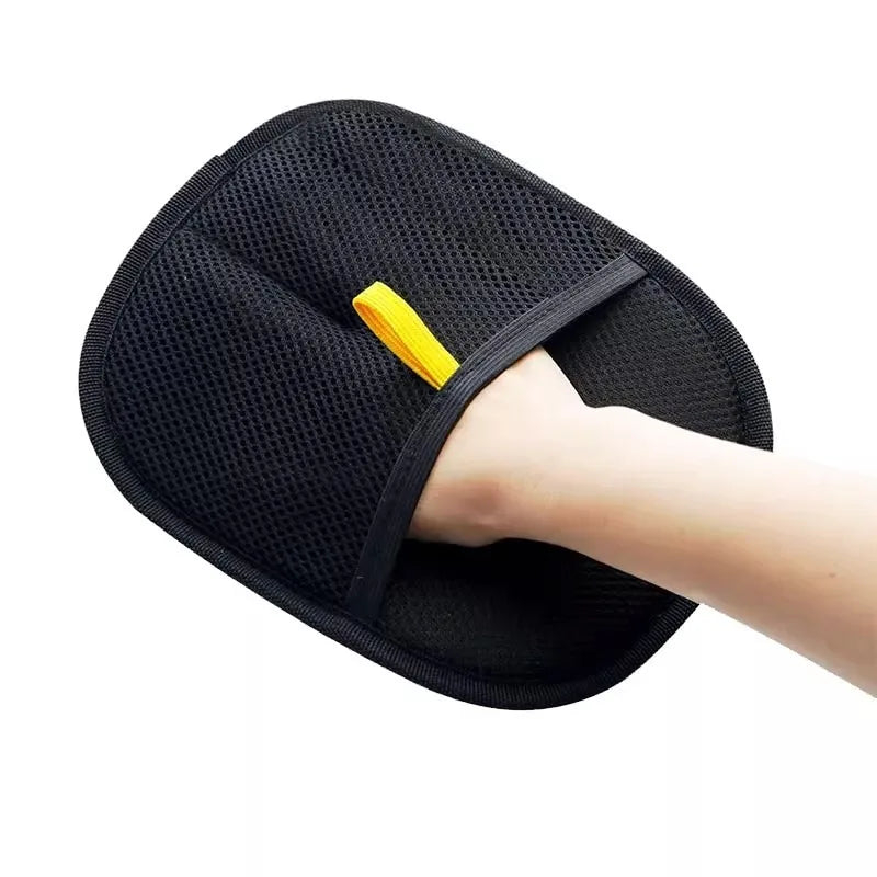 Hand wearing the double-sided pet grooming glove