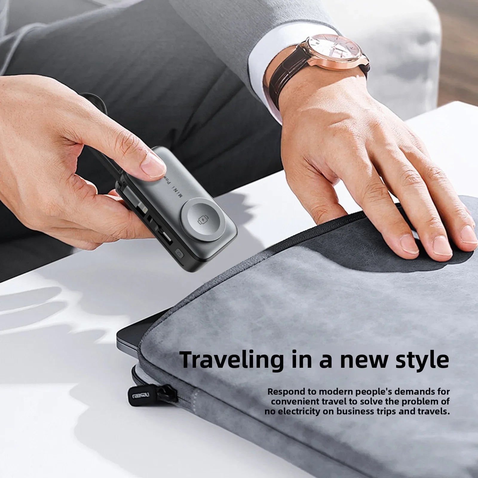 The power bank being slipped into a laptop sleeve pocket for travel