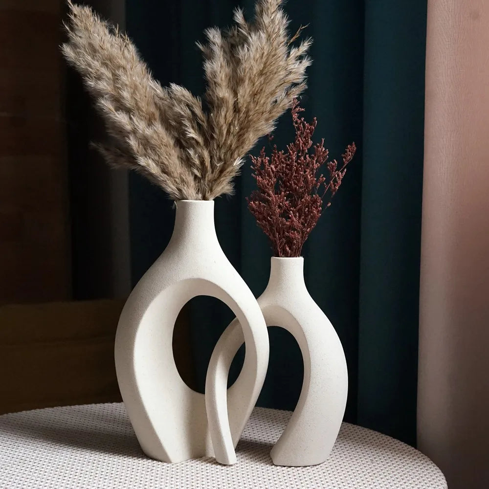 Cream snuggle vase set styled with pampas and dried stems on a dining table