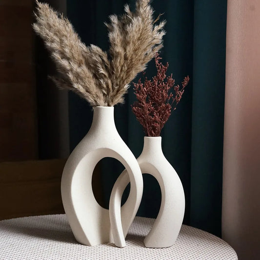 Cream snuggle vase set styled with pampas and dried stems on a dining table