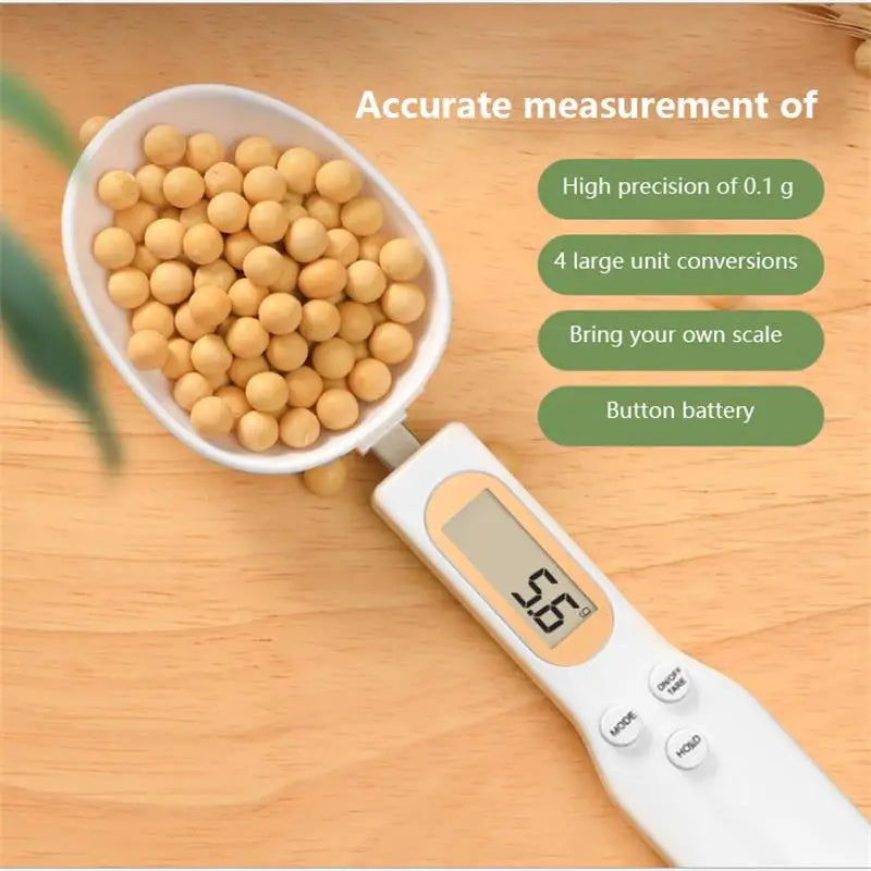Digital measuring spoon scale weighing soybeans, showing 0.1 g precision, unit switch and button battery
