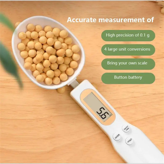 Digital measuring spoon scale weighing soybeans, showing 0.1 g precision, unit switch and button battery