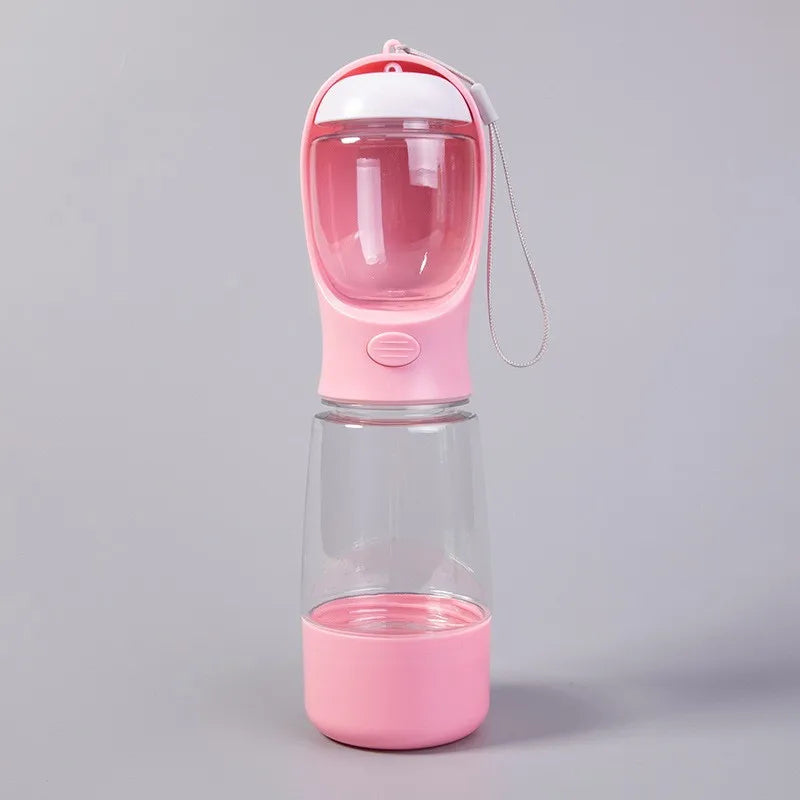 Pink 3-in-1 dog travel water bottle with wrist strap, full front view